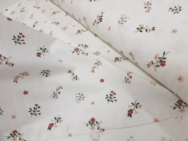 Bombažni jersey - šopki rožic na smetana osnovi